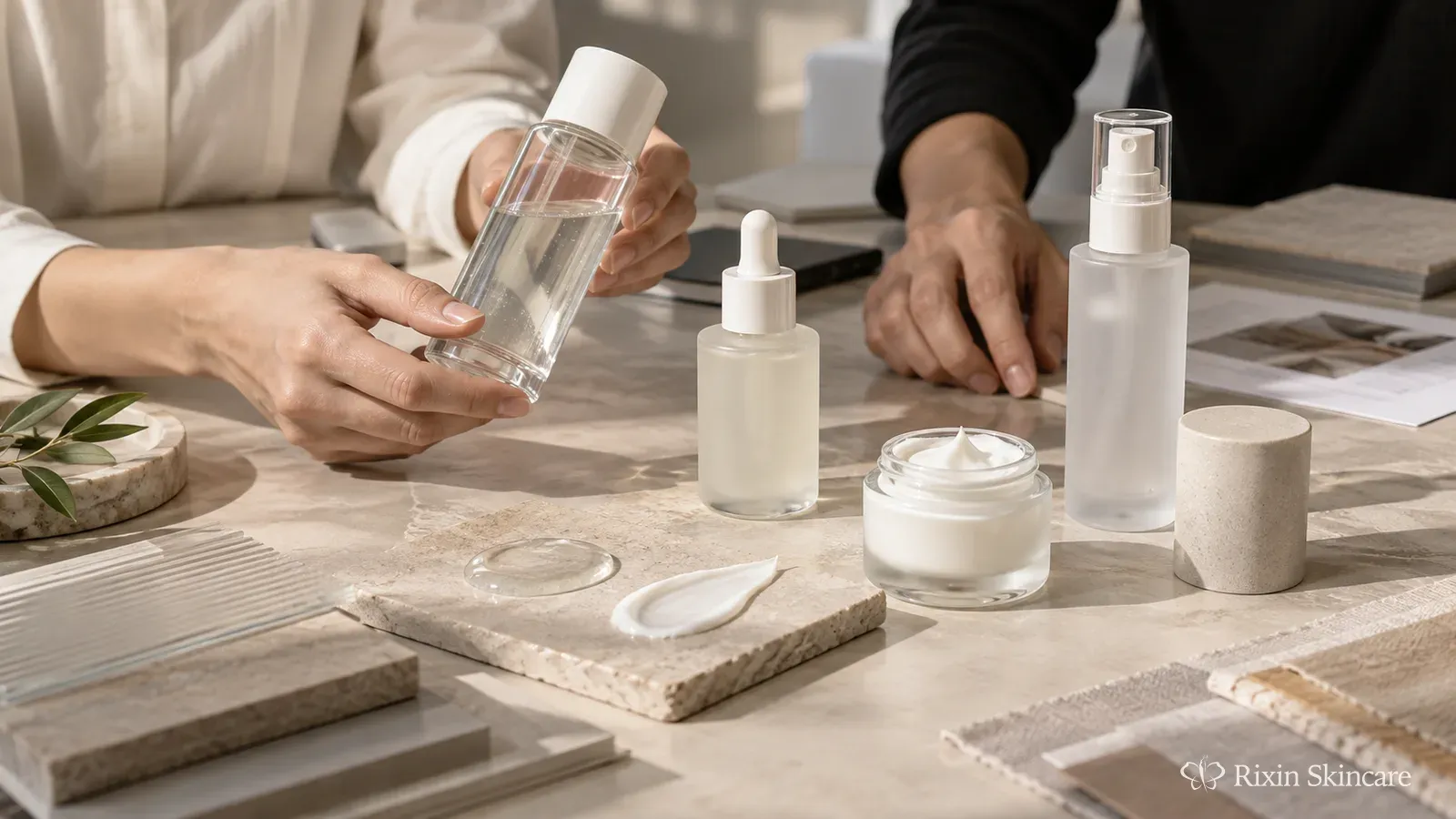 Skincare product development workspace with unbranded prototype formats, packaging samples, and formula textures under review.