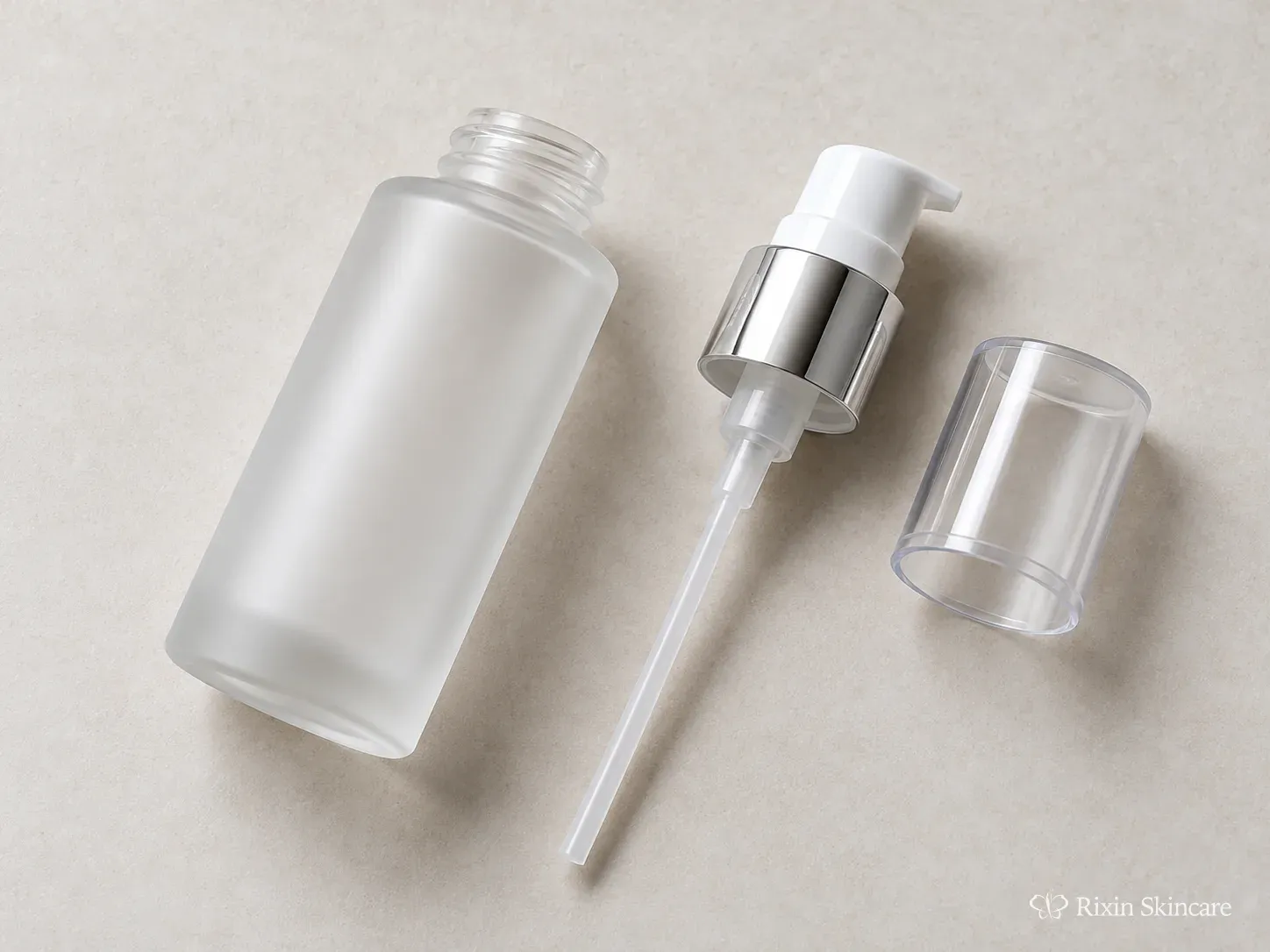 Unbranded skincare pump bottle and separated dispenser components showing the bottle body, pump collar, and dip tube.