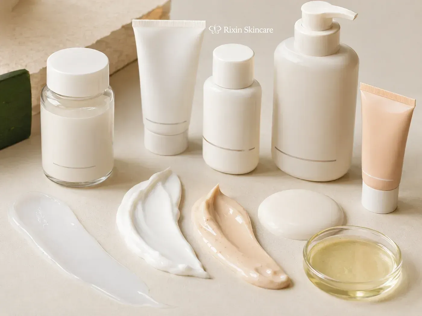 Sunscreen fluid, cream, tinted formula, suspension, and oil-phase samples arranged with compatible tubes and pump bottles